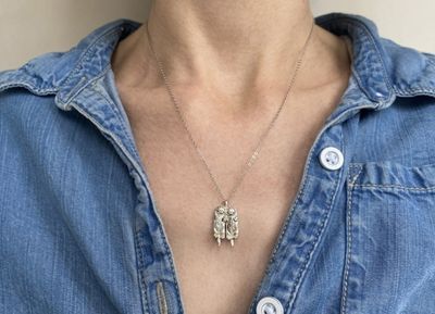 Alternate image for Two Silver Otters Holding Hands Necklace